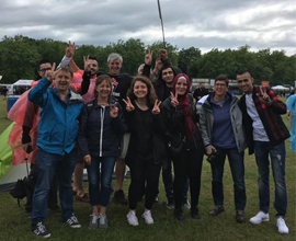 students smiling in a field